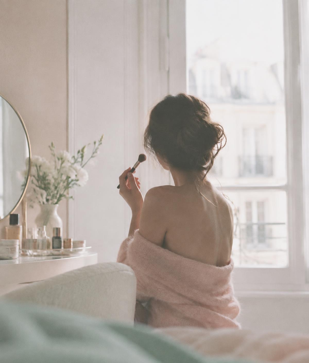 Shelli at her vanity in soft morning light